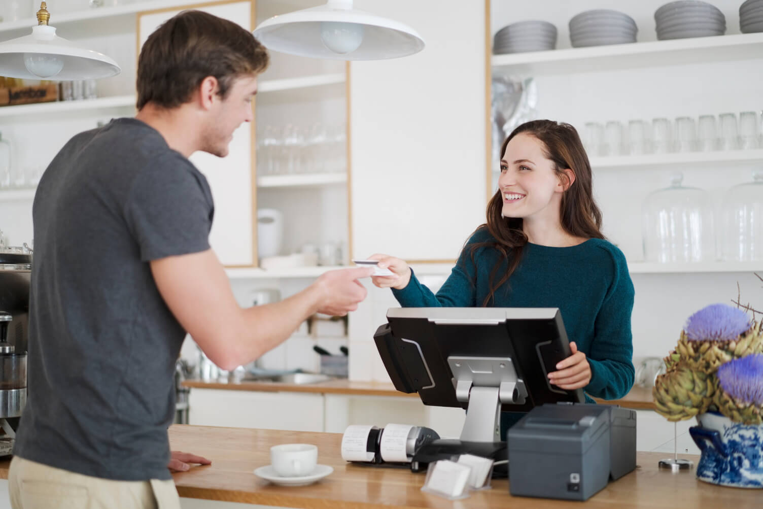 man on checkout till