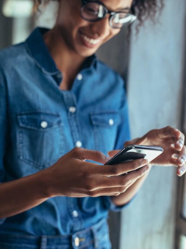 Woman applying for credit on her mobile phone