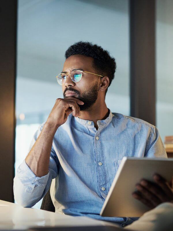 Man in an office assessing credit scores